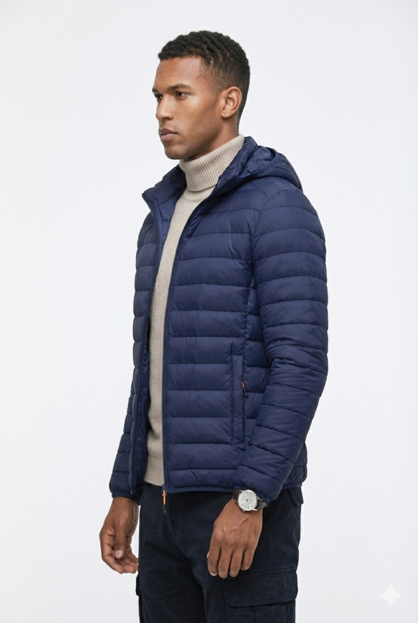 Close-up of a men's navy blue quilted puffer jacket with a built-in hood and horizontal stitching.